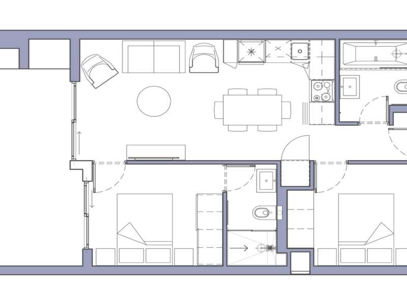 A clear architectural floor plan showing a two-bedroom apartment layout with an open-plan living area, kitchen, and two bathrooms.