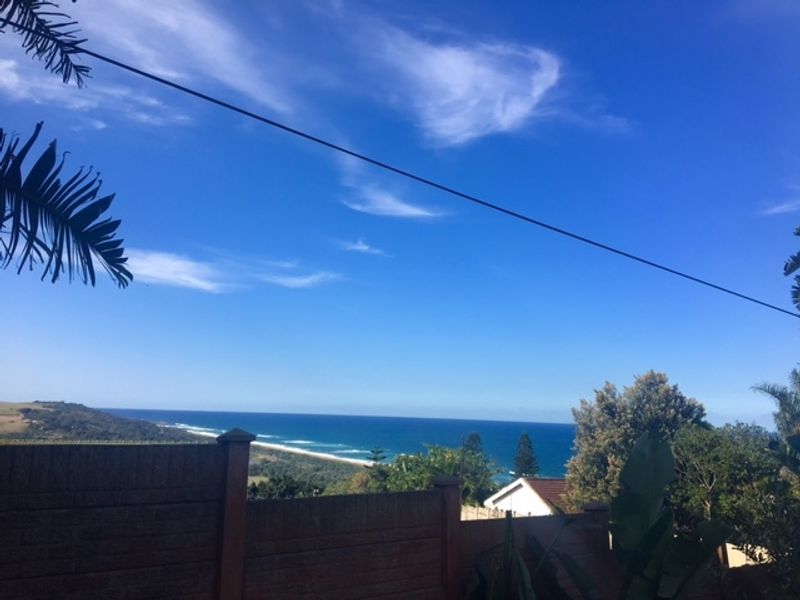 A scenic elevated view overlooking the coastline and ocean.
