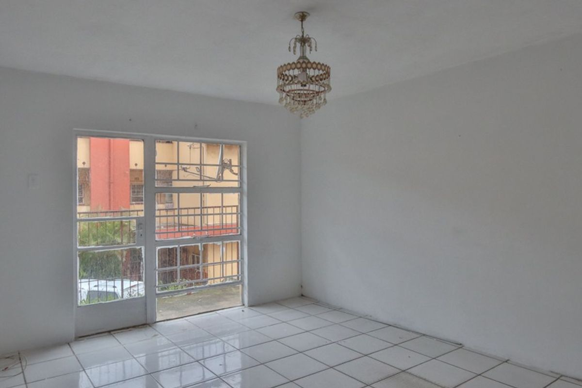 Looking for a fixer upper? Two Bedroom Apartment in Secure Block - Photo 4