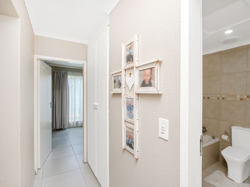Beautifully Maintained Modern Townhouse in Sought-After Rangeview Ext. 4 - Photo 8