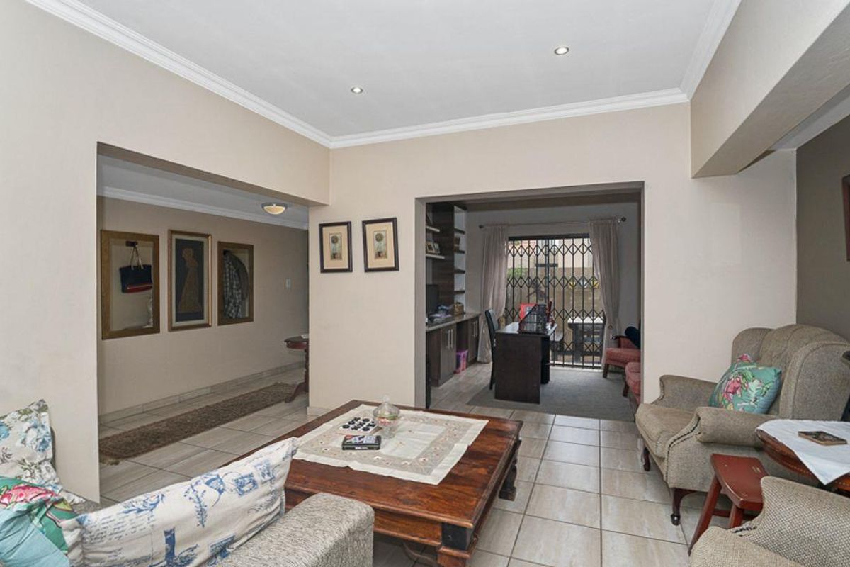 Picture-Perfect Renovated 3 Bedroom 2.5 Bathroom Home with Pool in Secure Estate - Photo 3