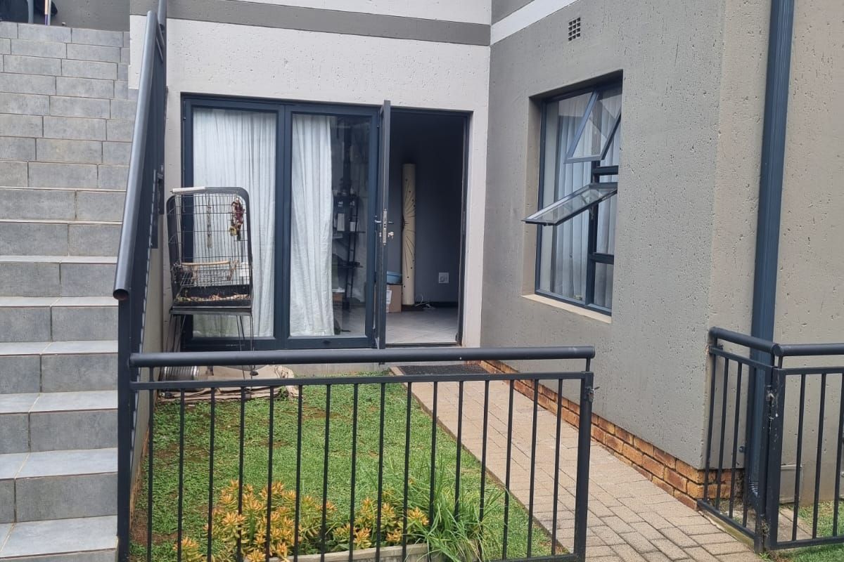 Charming Family Starter! Secure Ground Floor Home with Private Feel - Photo 2
