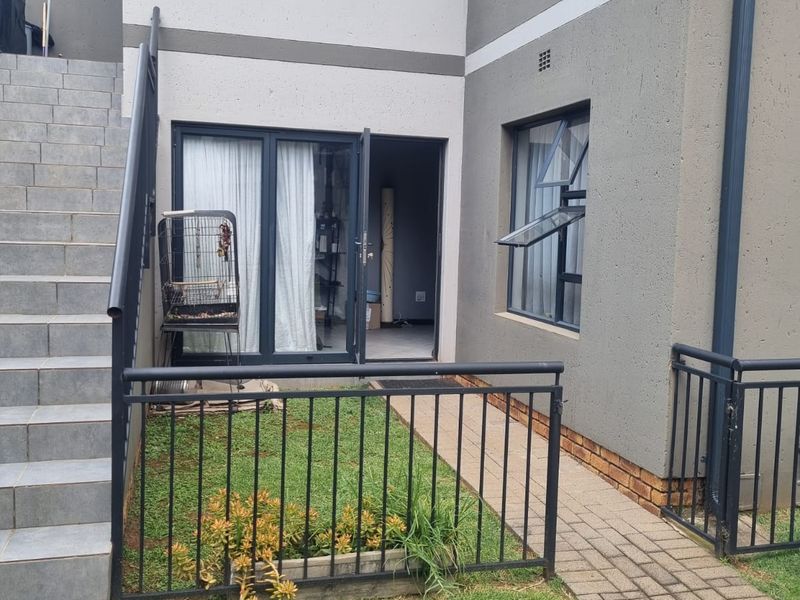 Charming Family Starter! Secure Ground Floor Home with Private Feel - Photo 2