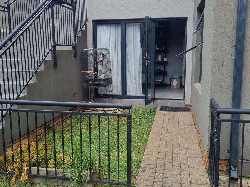 Charming Family Starter! Secure Ground Floor Home with Private Feel - Photo 1