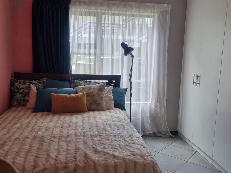 Charming Family Starter! Secure Ground Floor Home with Private Feel - Photo 8