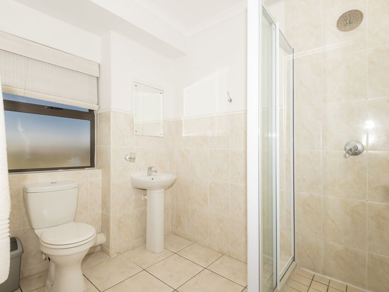 Tranquil First-Floor Apartment with Lagoon Views & Single Garage - Photo 10