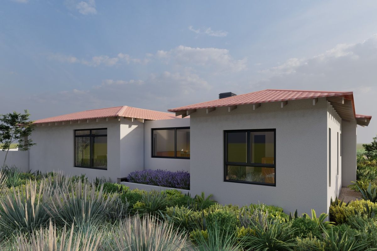 A modern residential exterior view featuring a tiled roof, clean rendered walls, and dark-framed windows set within a landscaped garden.