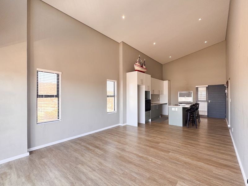 2 Bedroom + 2 Bath |  Top-Floor Coastal Sophistication with Panoramic Lagoon Views - Photo 9