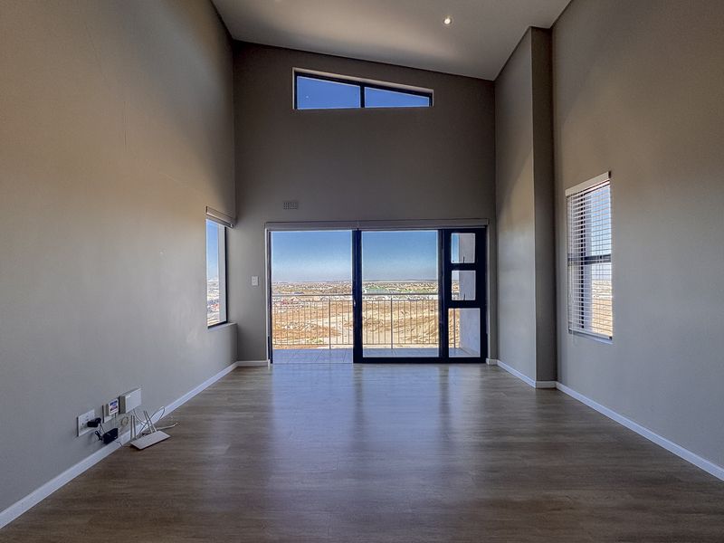 2 Bedroom + 2 Bath |  Top-Floor Coastal Sophistication with Panoramic Lagoon Views - Photo 3