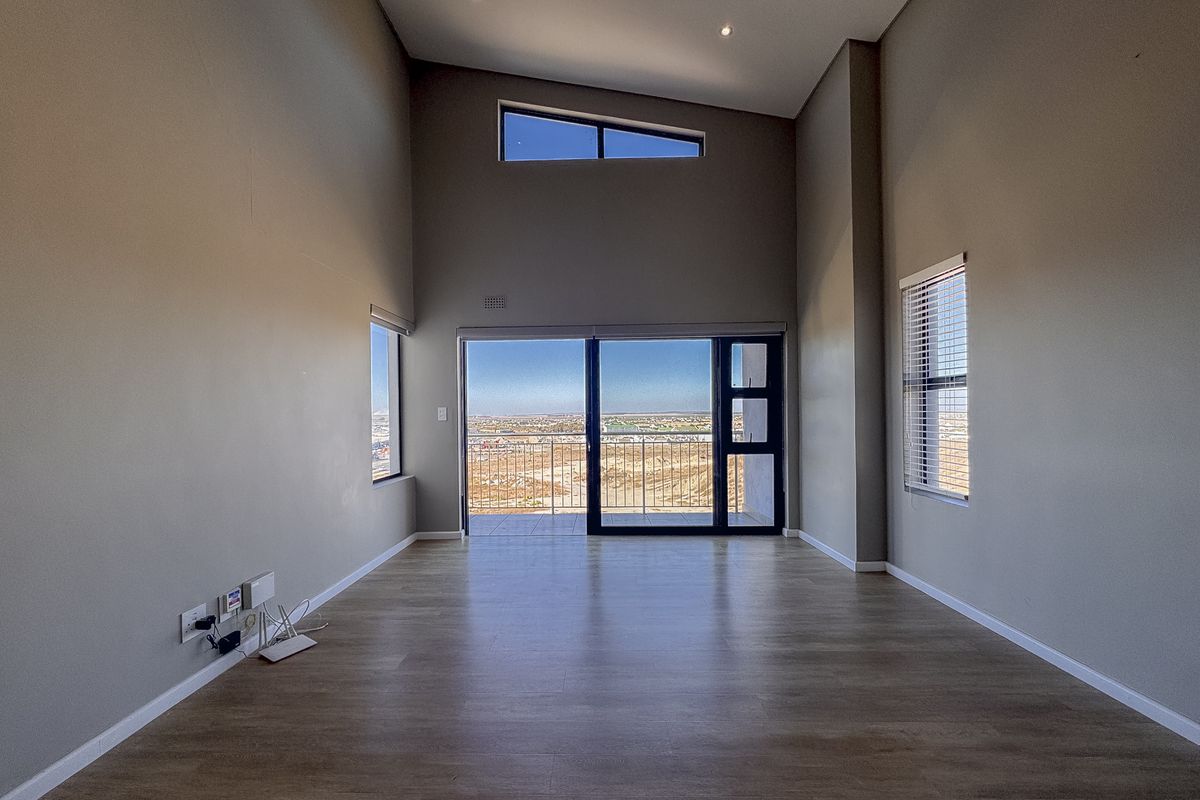 2 Bedroom + 2 Bath |  Top-Floor Coastal Sophistication with Panoramic Lagoon Views - Photo 3
