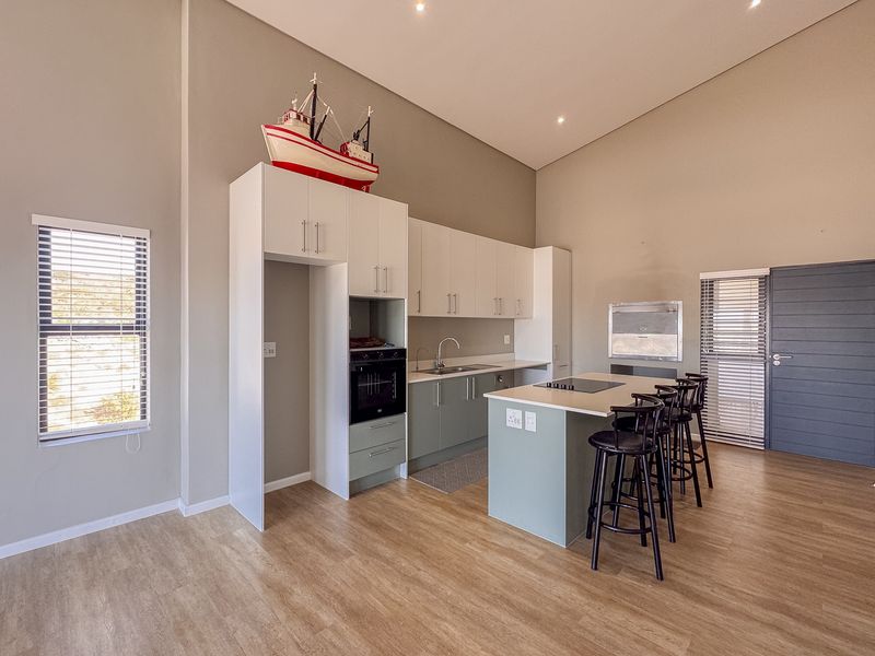 2 Bedroom + 2 Bath |  Top-Floor Coastal Sophistication with Panoramic Lagoon Views - Photo 6