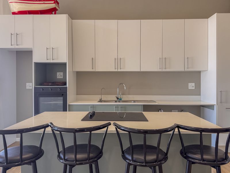 2 Bedroom + 2 Bath |  Top-Floor Coastal Sophistication with Panoramic Lagoon Views - Photo 5