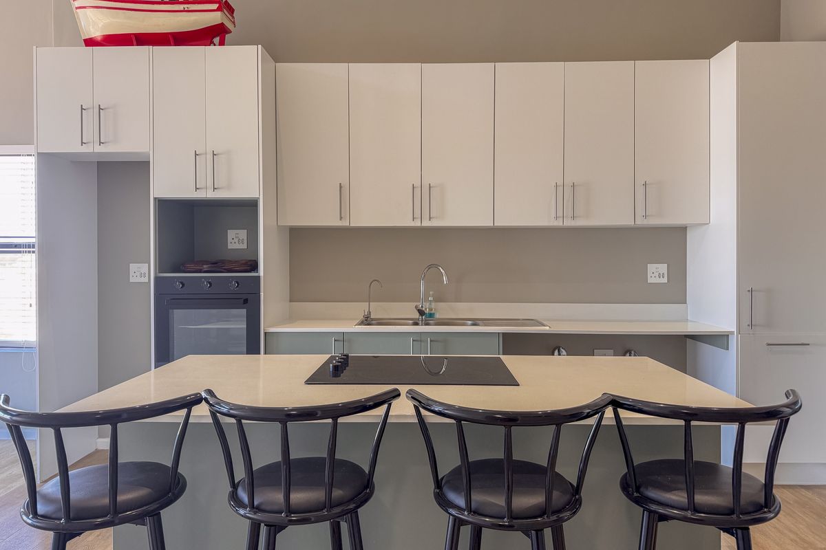 2 Bedroom + 2 Bath |  Top-Floor Coastal Sophistication with Panoramic Lagoon Views - Photo 5