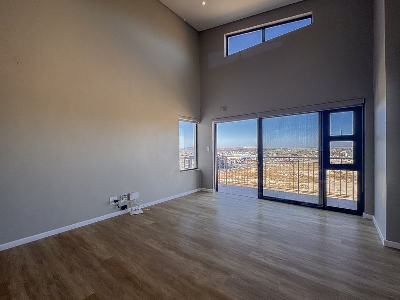 2 Bedroom + 2 Bath |  Top-Floor Coastal Sophistication with Panoramic Lagoon Views - Photo 2