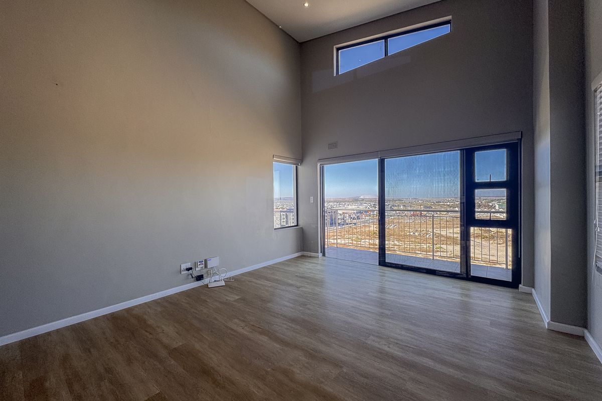 2 Bedroom + 2 Bath |  Top-Floor Coastal Sophistication with Panoramic Lagoon Views - Photo 2