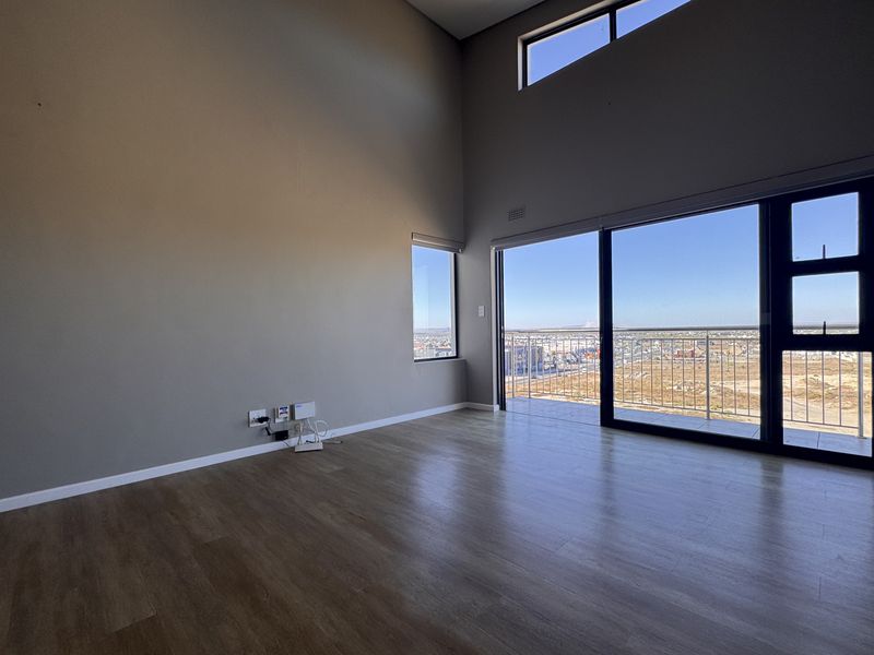 2 Bedroom + 2 Bath |  Top-Floor Coastal Sophistication with Panoramic Lagoon Views - Photo 4