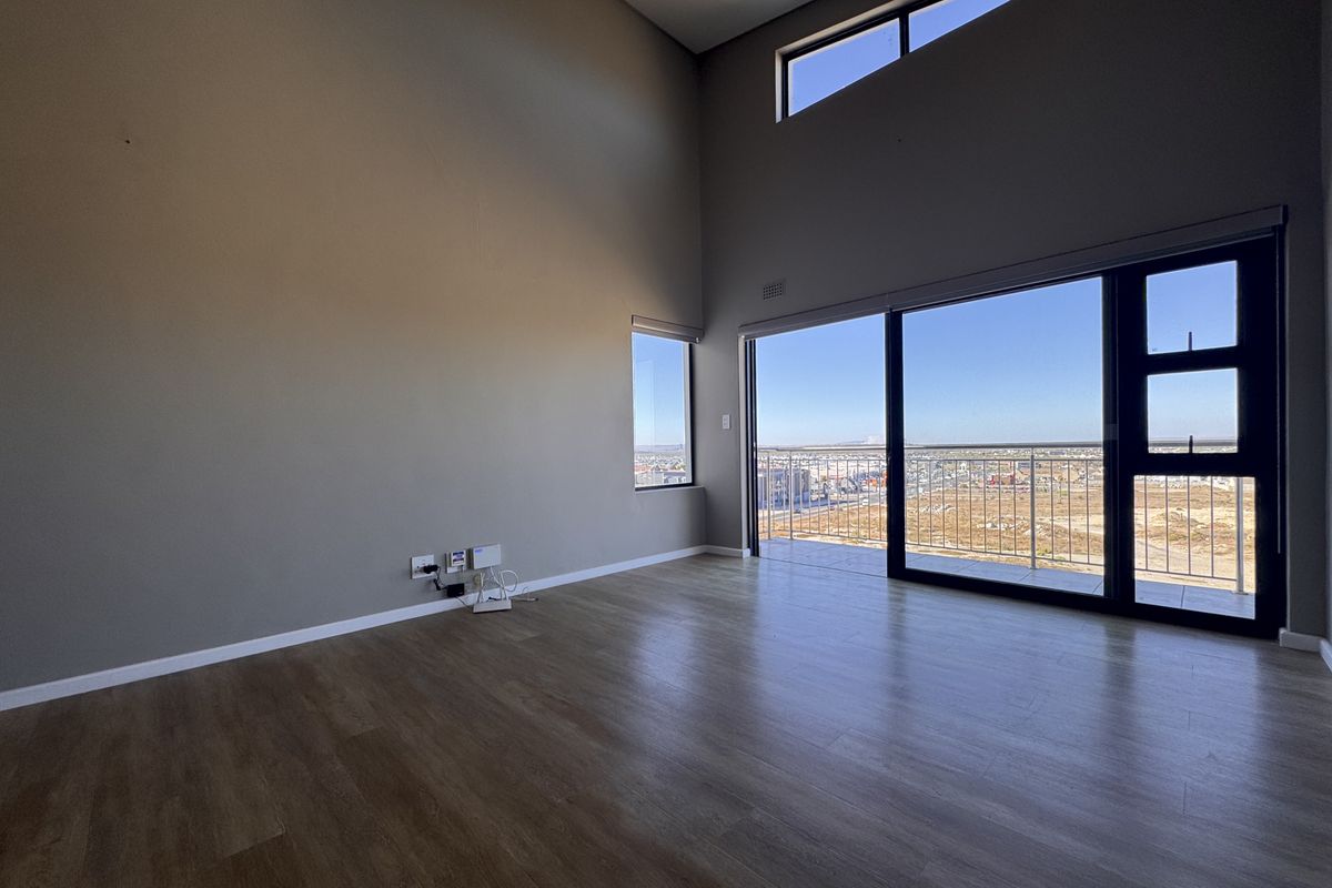 2 Bedroom + 2 Bath |  Top-Floor Coastal Sophistication with Panoramic Lagoon Views - Photo 4