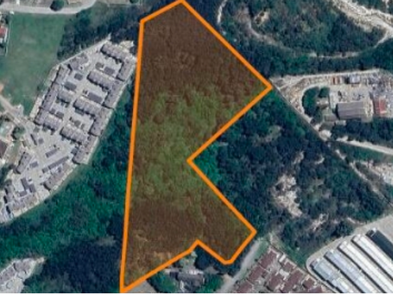 An aerial view showing the boundaries of the vacant residential land plot within the surrounding neighborhood.