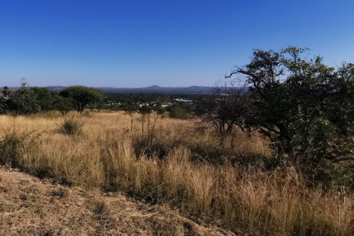 A scenic view overlooking the natural landscape and surrounding area from the vacant commercial property.