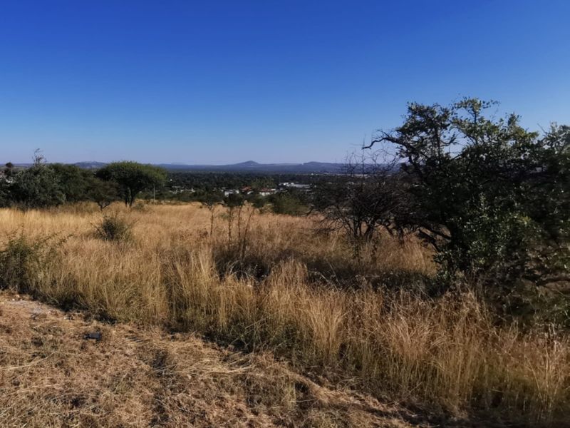 A scenic view overlooking the natural landscape and surrounding area from the vacant commercial property.