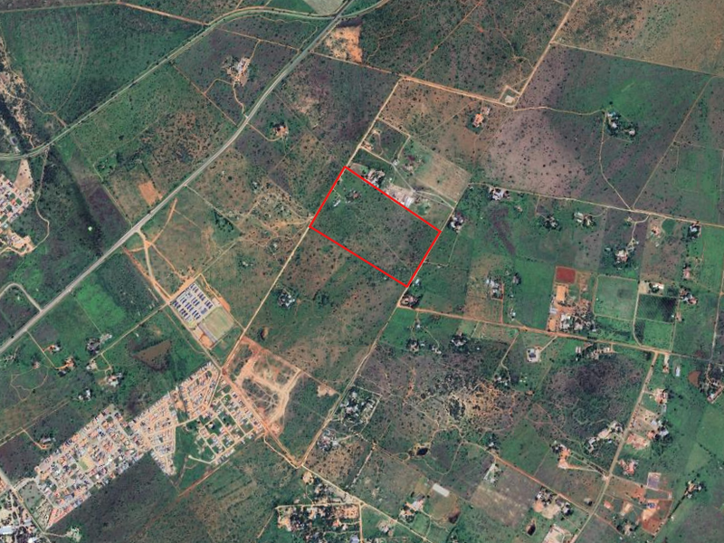 An aerial view of the small holding property, highlighting the land boundaries and surrounding rural landscape.