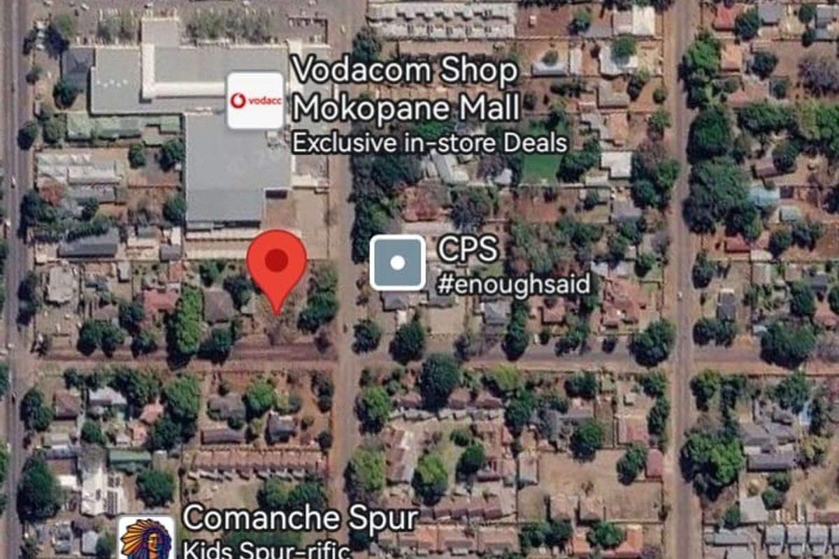 An aerial satellite view showing the location of the vacant residential land plot within the surrounding urban neighborhood.