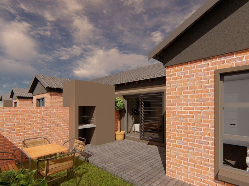 Rear exterior view of a townhouse featuring a paved patio, built-in braai, and brick facade with modern security shutters.