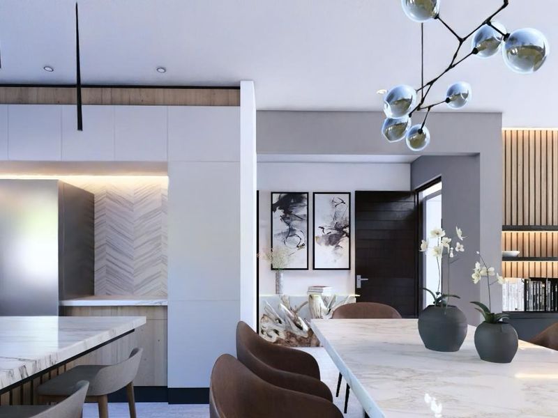 Modern open-plan living and kitchen area featuring a marble island, sleek cabinetry, and contemporary slatted wood wall accents.