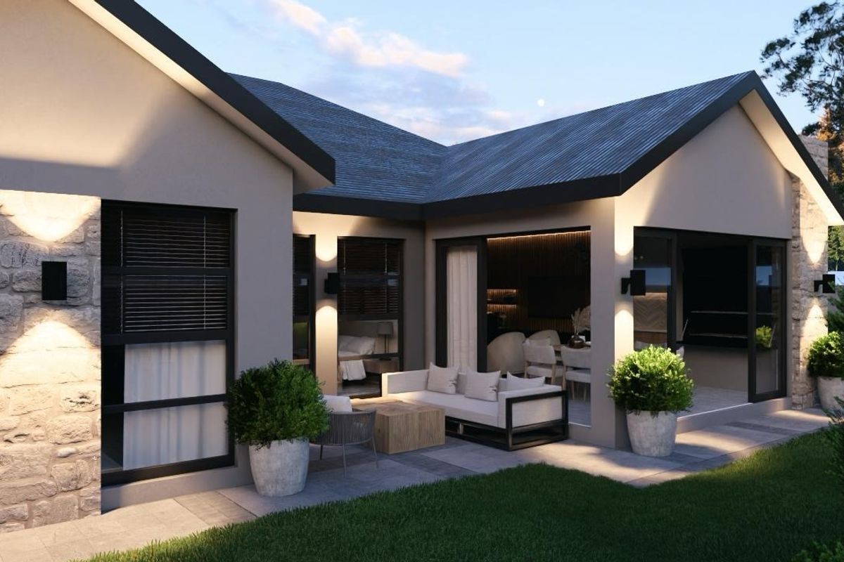 A modern rear exterior view featuring a covered patio, stone wall accents, and large sliding glass doors leading into the home's living space.