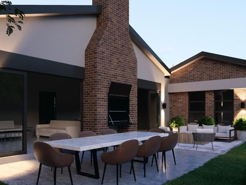 A modern covered patio area featuring a built-in brick braai, paved flooring, and integrated exterior lighting, perfect for outdoor entertaining.