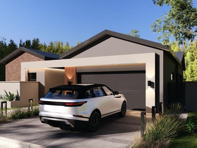 Modern residential front facade featuring a sleek garage, paved driveway, and contemporary architectural detailing with integrated exterior lighting.
