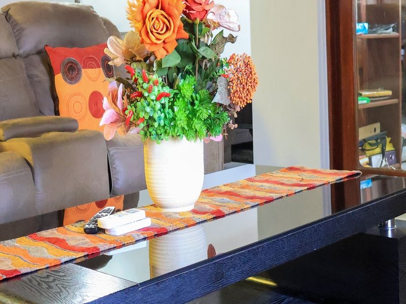 A close-up view of a living room surface featuring decorative elements, focusing on interior living space details.