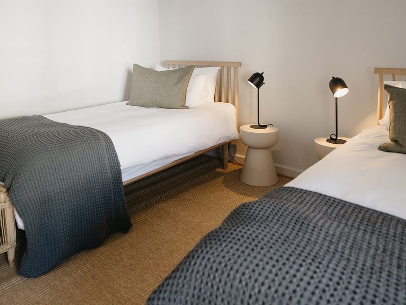 A well-presented bedroom featuring neutral walls and clean finishes, providing a comfortable and inviting sleeping space.