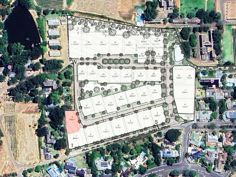 An aerial site development plan showing the layout of residential land parcels, internal road networks, and surrounding estate infrastructure.