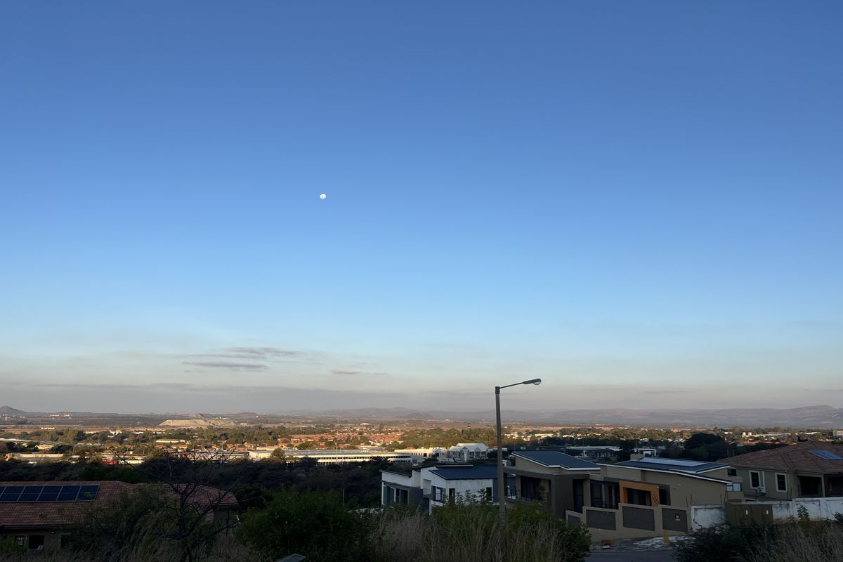 A scenic elevated view overlooking the surrounding residential neighborhood and distant landscape under a clear blue sky.
