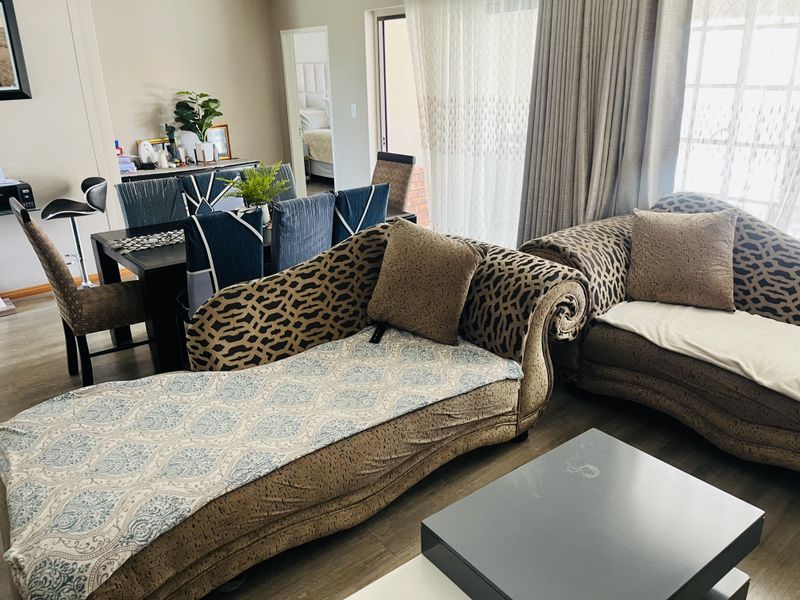 Open plan living and dining area featuring laminate flooring and a sliding glass door providing access to the exterior.