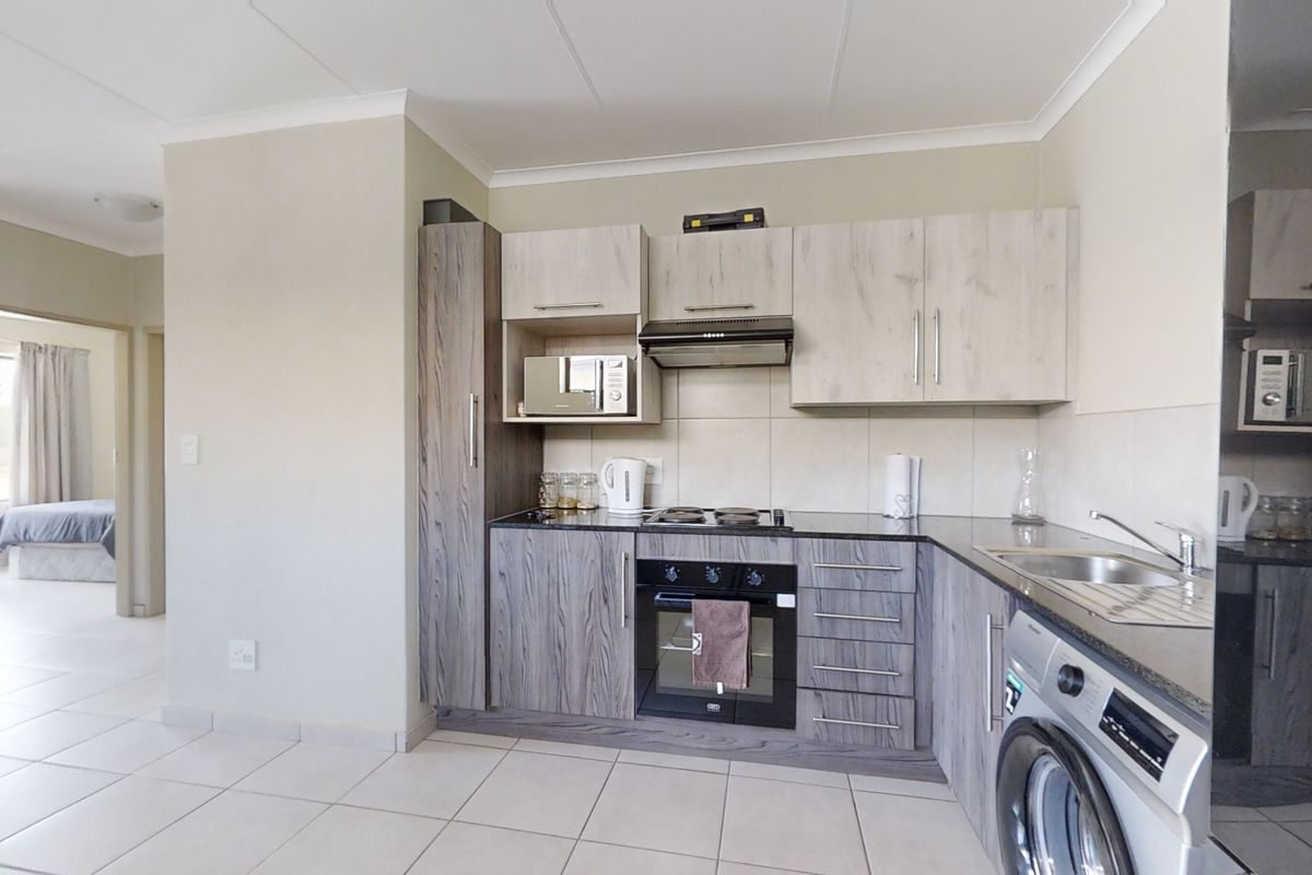 First Floor Unit in Modern Complex! - Photo 3