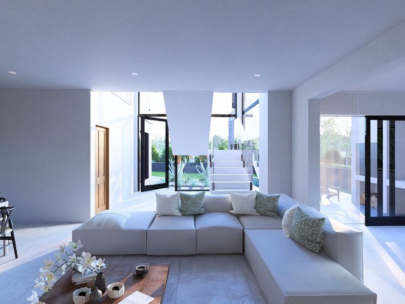 Modern open-plan living area featuring large format floor tiles, a striking suspended fireplace, and seamless access to the outdoor patio through glass sliding doors.