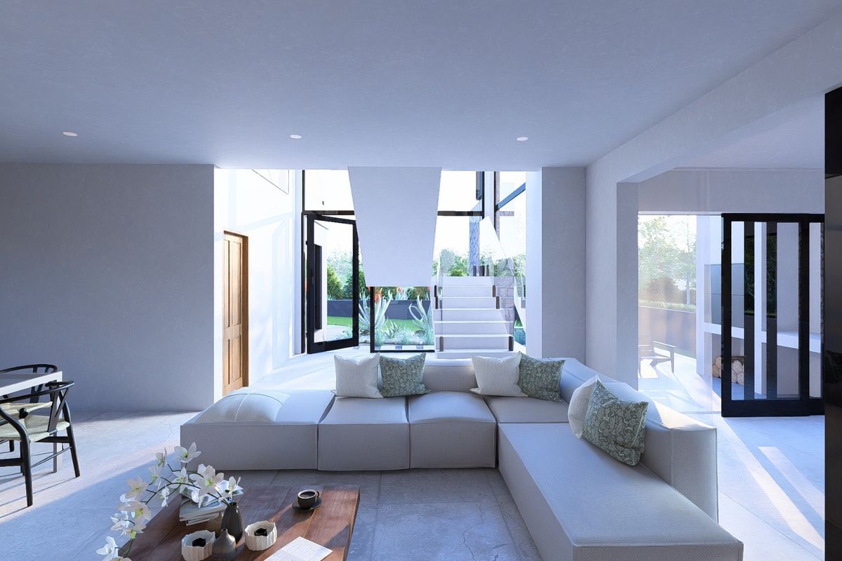 Modern open-plan living area featuring large format floor tiles, a striking suspended fireplace, and seamless access to the outdoor patio through glass sliding doors.