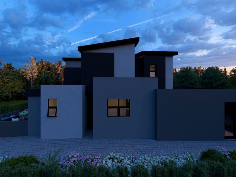 A modern architectural house exterior featuring a striking two-tone facade, skillion roof design, and neatly landscaped front garden at dusk.