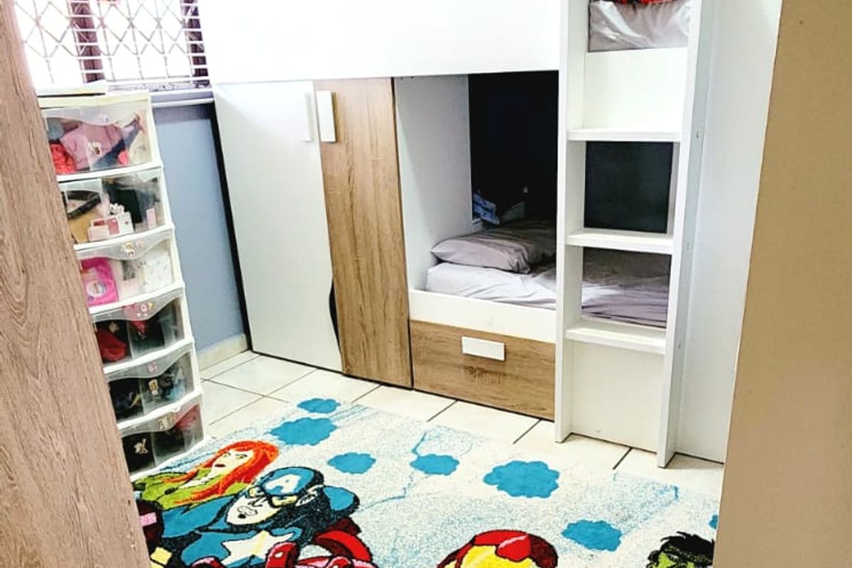 A bedroom featuring tiled flooring and a window fitted with security bars and venetian blinds.