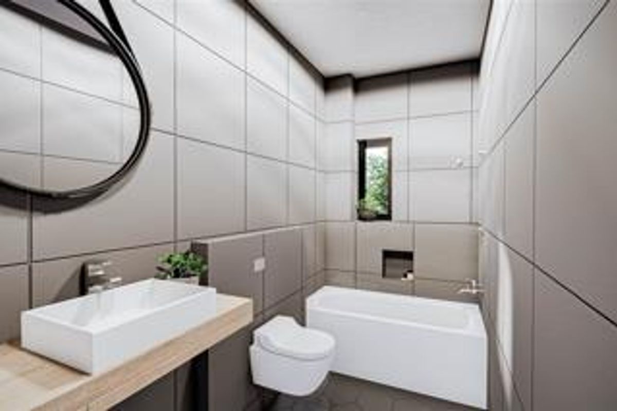 Modern bathroom featuring large-format wall tiles, a floating vanity with a vessel sink, a wall-mounted toilet, and a built-in bathtub with a recessed niche.
