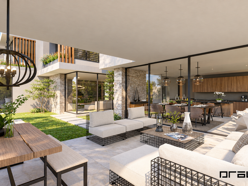 A modern covered patio featuring stone cladding, large format tiles, and seamless indoor-outdoor flow into the open-plan living and dining area.