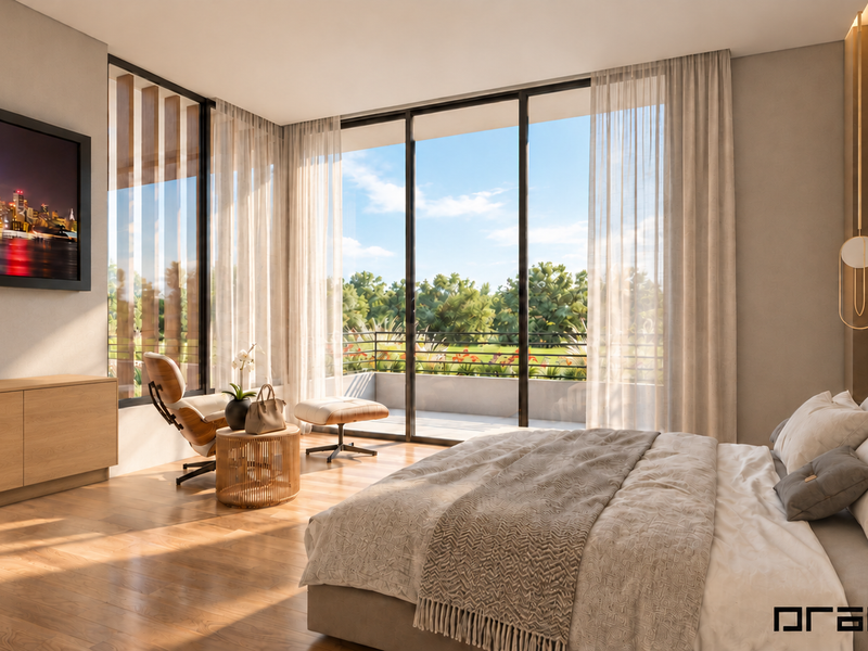 A modern, well-lit bedroom featuring hardwood floors, built-in cabinetry, and large sliding glass doors that open onto a private balcony with scenic views.