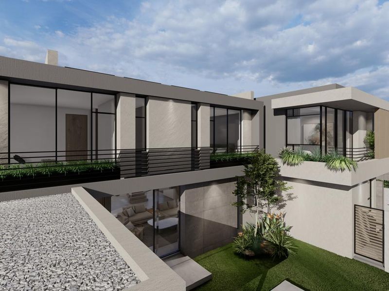 A modern architectural exterior view of a cluster home featuring clean lines, large glass windows, balconies, and a landscaped rear garden area.