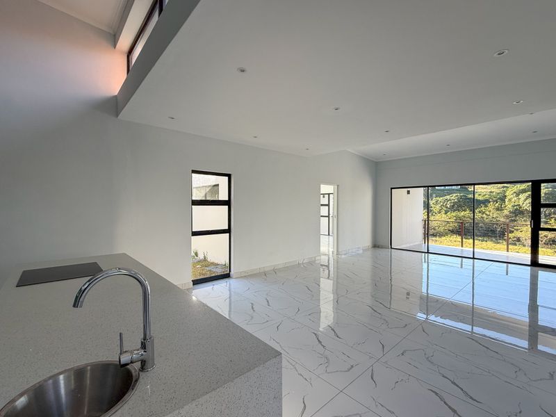 Modern 4-Bedroom Home in Palm Lakes Estate – Contemporary Living Surrounded by Nature - Photo 7