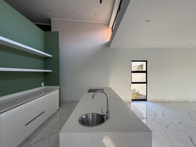 Modern 4-Bedroom Home in Palm Lakes Estate – Contemporary Living Surrounded by Nature - Photo 4