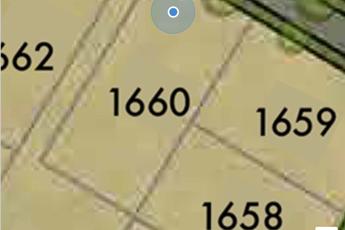 An aerial map view showing the layout and positioning of residential land plot 1660 within the surrounding neighborhood.