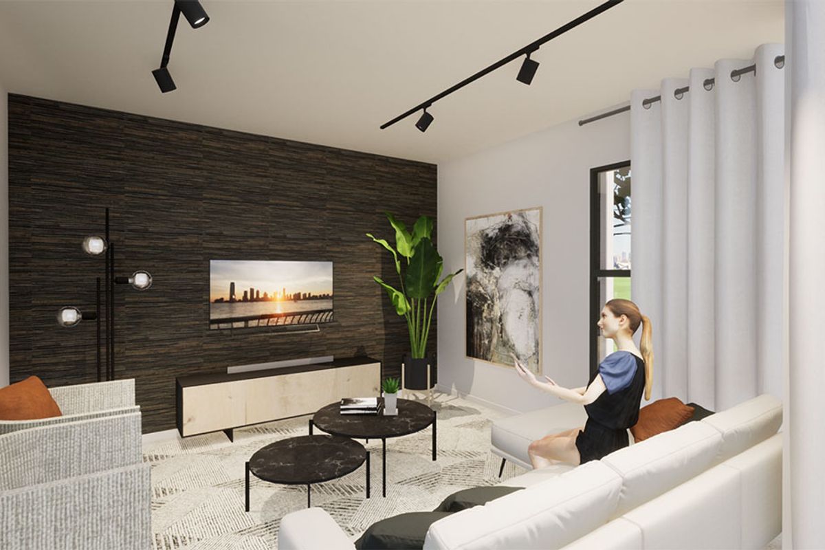 Modern living room featuring a dark textured accent wall, track lighting, and large windows with neutral curtains.