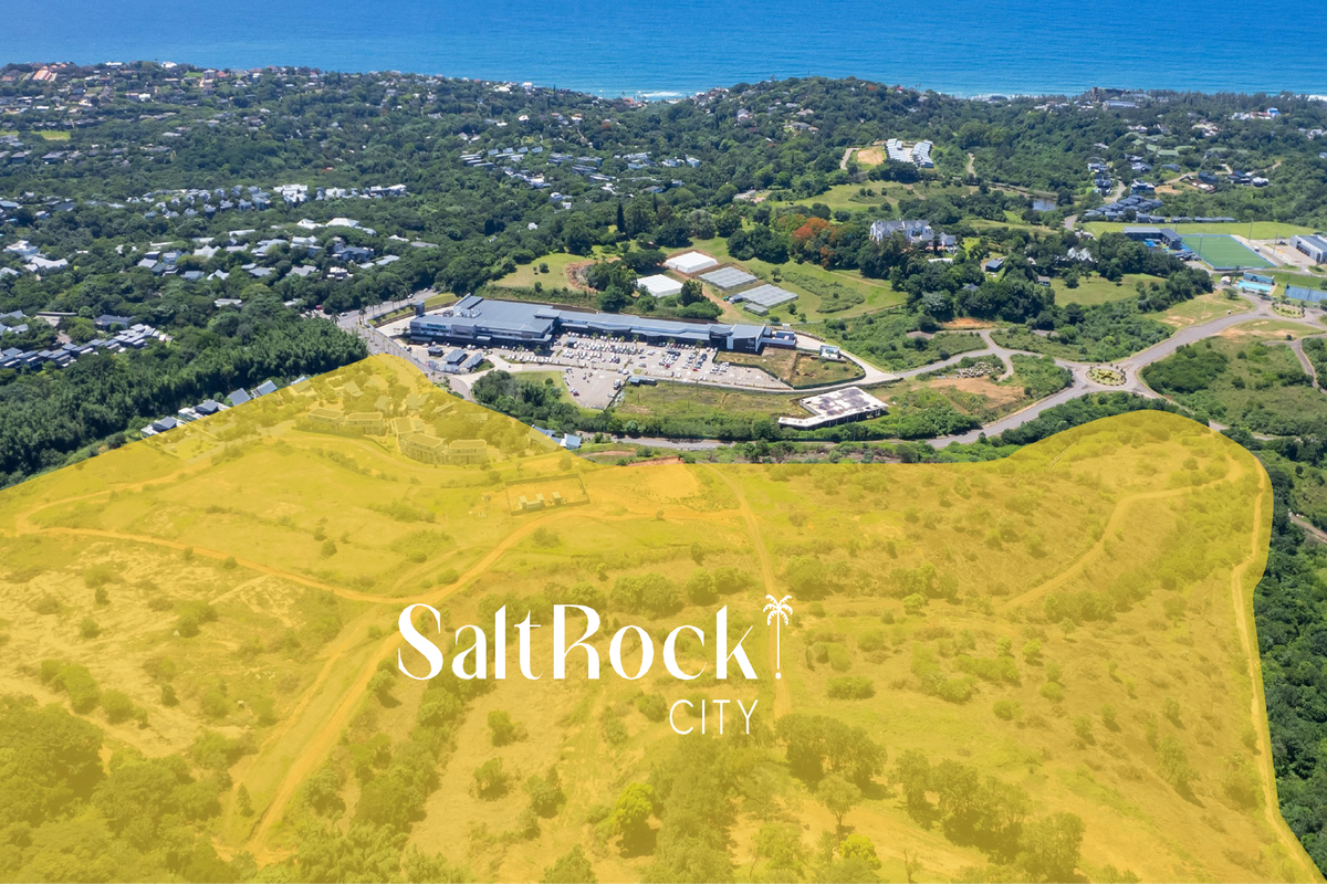 Aerial view of a large, undeveloped residential land parcel in Salt Rock, showcasing the surrounding landscape and proximity to local amenities.